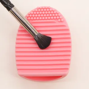 Detail shot of pink silicone makeup brush cleaner tool for quick and effective washing.