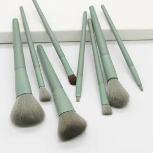 Close-up detail view of the soft grey bristles and matcha green handle on the makeup brush set.