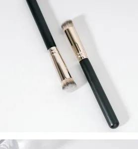 Detailed shot of professional black handle makeup brushes with soft dense bristles for flawless.