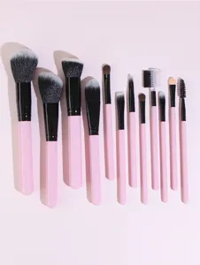 12-piece pink makeup brush set, professional cosmetic tools for eyeshadow, blush, and contour.