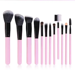 Set of 12 pink makeup brushes, soft synthetic bristles, ergonomic handles for flawless application.