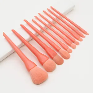 Detail view of a 10-piece candy pink makeup brush set with soft bristles for flawless makeup.