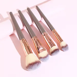 Detailed view of professional makeup brushes with soft bristles and rose gold ferrules.