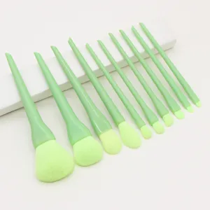 Close up detail of 10 pieces green makeup brush set, soft synthetic bristles