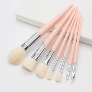 7-piece pink makeup brush set with soft synthetic hair and sleek handles for daily beauty.