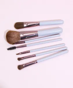 Detail view of the 7-piece light purple makeup brush set showing soft bristles and handles.