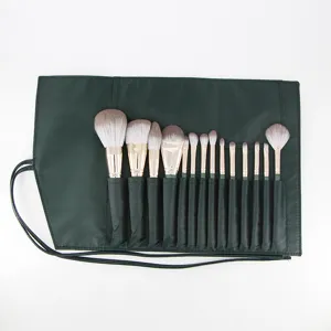 14-piece professional makeup brush set with dark green roll bag, soft cosmetic tools for blending.
