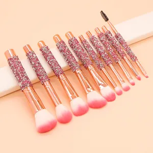 Detailed view of the 10-piece rhinestone makeup brush set, featuring pink glitter handles.