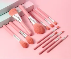 Detailed view of the pink makeup brush set featuring soft bristles and sleek handles.