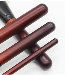Detailed view of wooden handle makeup brush set, professional cosmetic tool for daily beauty.