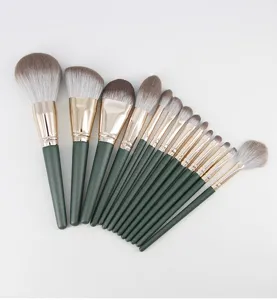 Detail view of 14-piece professional makeup brush set with green handles and soft bristles.