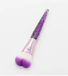 Heart-shaped makeup brush with purple glitter handle for powder contour blush application.