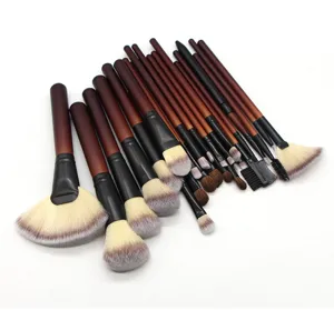 Professional 26 piece makeup brush set with wooden handles for facial and eye application detail.