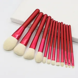 Professional 12-piece red makeup brush set with soft bristles for face and eye cosmetic use.