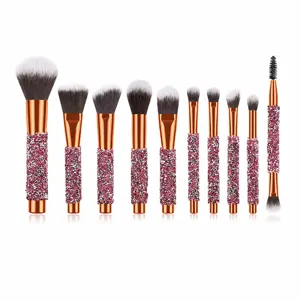 Professional 10-piece crystal makeup brush set with pink rhinestones and soft synthetic bristles.