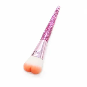Heart-shaped makeup brush with pink glitter handle soft bristles for blush and powder application