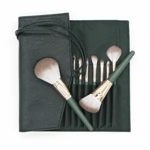 Green cloud 14-piece makeup brush set with dark green roll bag and soft bristle brushes.