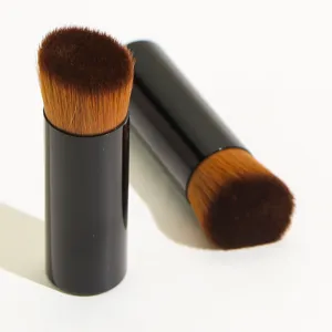 Portable short-handle angled foundation makeup brush with dense brown bristles for smooth application.