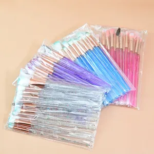 Detail view of colorful crystal handle makeup brush set with glitter design for eye blending.