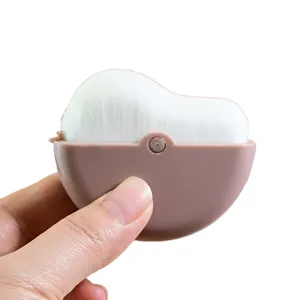 Portable folding makeup brush with dust cover, soft bristles for setting powder and contour.