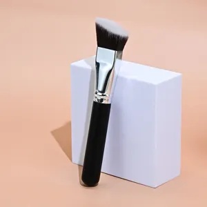 Angled makeup brush detail shot, perfect for seamless foundation application and contouring blending.
