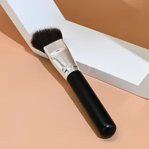 Detail view of the angled triangle makeup brush for seamless foundation and contour application.