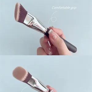 Oblique triangle makeup brush for flawless foundation application and highlighter blending.