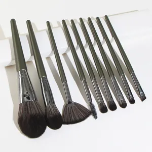 9-piece makeup brush set with dark green handles and soft bristles for precise application.
