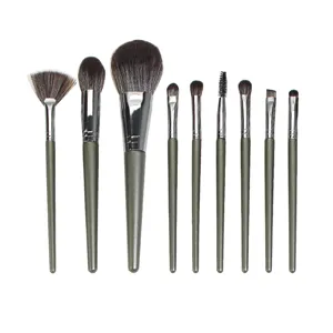 Professional 9-piece makeup brush set with soft synthetic bristles for powder and eyeshadow application.
