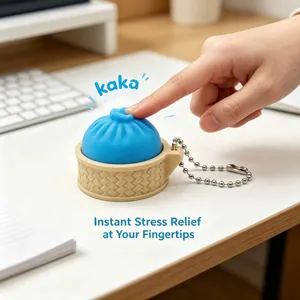 Detailed close-up shot of the cute dumpling stress relief toy keychain on a clean wooden office desk.