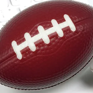 PU foam football stress relief toy, brown squeeze ball detail shot for hand exercise grip.