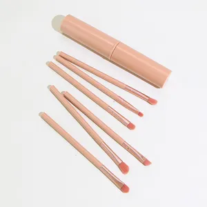 Portable 6-piece pink makeup brush set with storage cylinder, ideal for eye shadow and contouring.