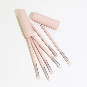 Pink 6-piece travel makeup brush set with cute round storage container for precise eye makeup.