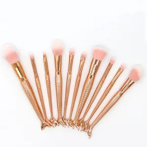 Set de 10 brochas de maquillaje sirena con mangos de cola de pez 3D y cerdas suaves.