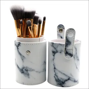 Detail view of the 10-piece makeup brush set with marble pattern PU leather storage cylinder.