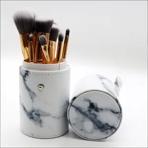 Marble pattern PU storage barrel detail view showing the compact makeup brush set container.