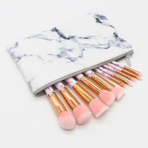 Detail view of 10-piece marble makeup brush set with elegant pink bristles and PU storage pouch.