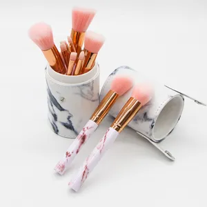 10-piece marble pattern makeup brush set with PU holder for professional cosmetic application.