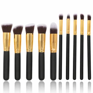 Kit de 10 pinceaux de maquillage professionnels avec manches noirs et violes dorées pour le teint.