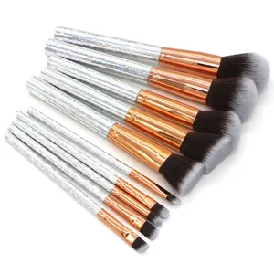 10-piece professional makeup brush set with holographic glitter handles and soft synthetic bristles.