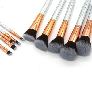 Detailed view of a 10pcs makeup brush set with sparkly handles and rose gold ferrules.