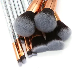 Professional 10-piece makeup brush set detail, rose gold ferrules and glitter silver handles.