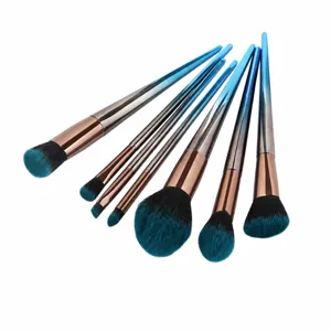 Professional makeup brush set with gradient blue handles and soft bristles for face makeup.