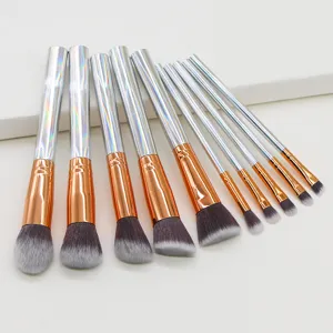 Professional 10-piece makeup brush set with holographic handles and soft gradient bristles.