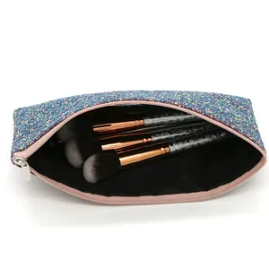 Glitter makeup bag with marble pattern cosmetic brushes, stylish portable beauty tool set.