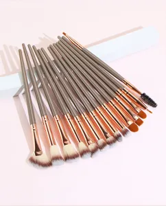 Detail view of professional makeup brush set with brown handles and soft synthetic bristles
