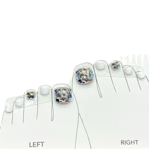 Handmade press-on toenails with colorful sparkling rhinestones and white polish for stunning feet.