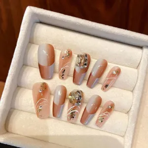 Handmade press-on nail set, nude grey gradient long coffin fake nails with crystals and gold foil.