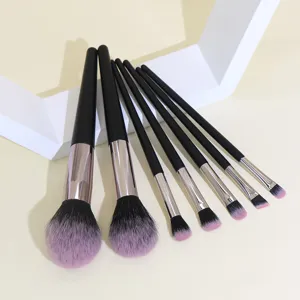 7-piece black makeup brush set with ultra-soft pink bristles for powder and eyeshadow.