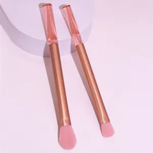 Close-up of pink liquid glitter handle makeup brushes with soft bristles for detail eye makeup application.